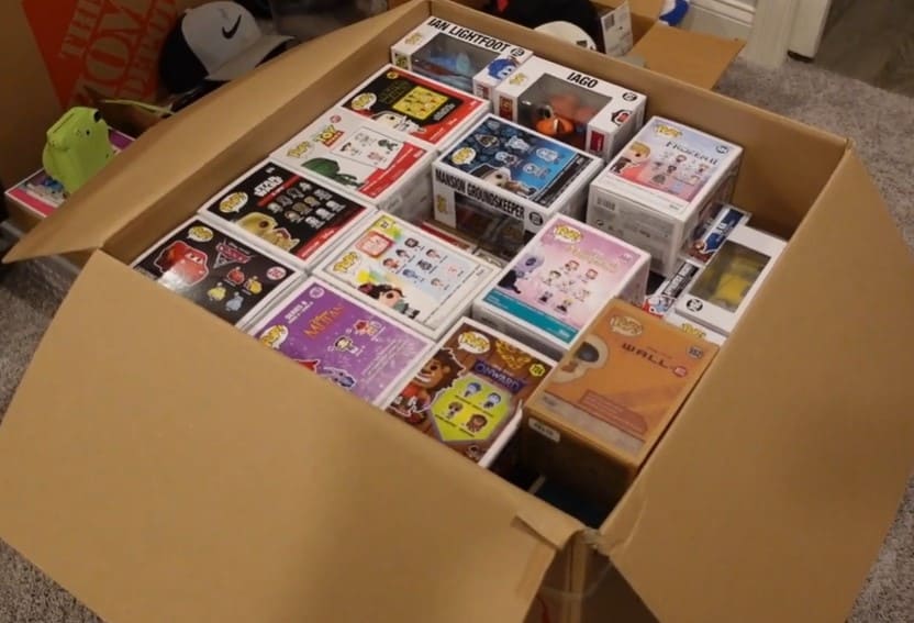 funko pop lot in a large shipping carton